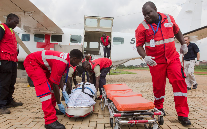 Paramedics Loading Patient to Stretcher